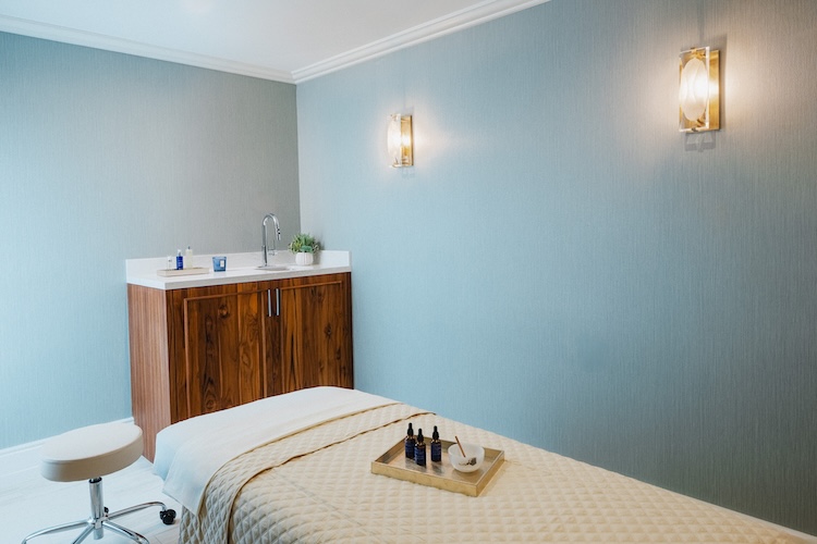 a room with a bed and a sink