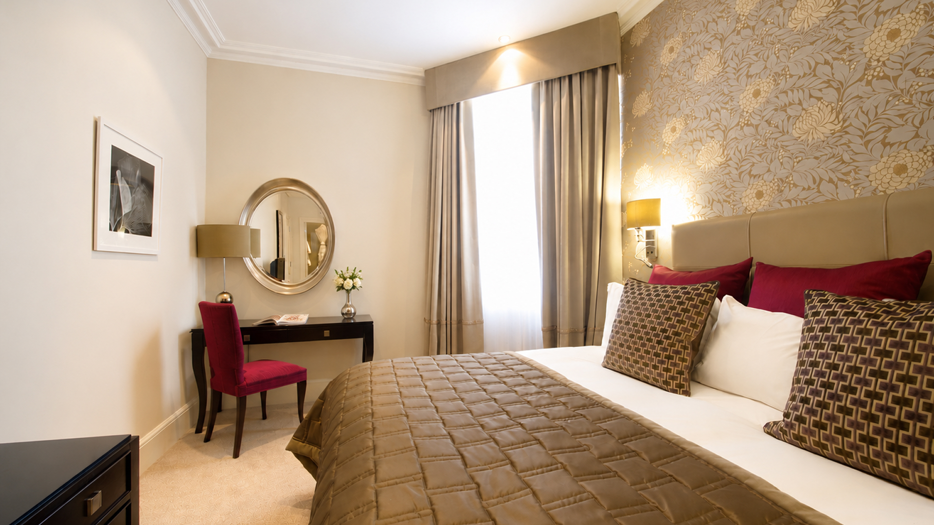 a bedroom with a bed and a chair