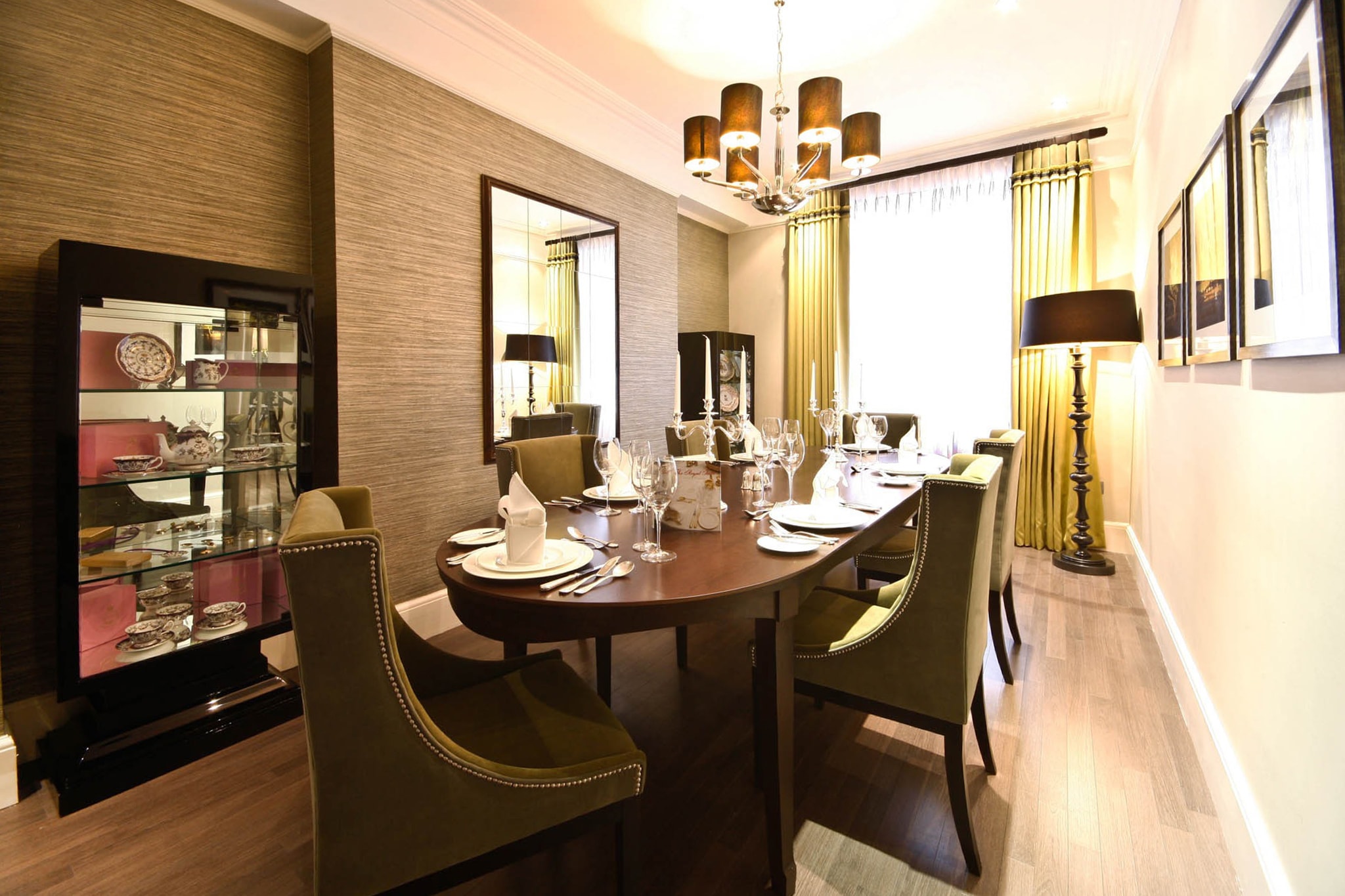 a dining room with a table and chairs