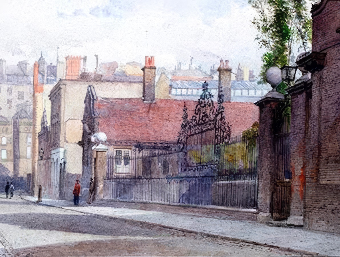 a street with a fence and a person walking