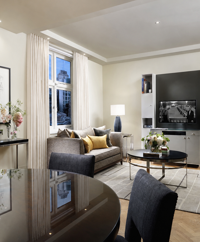 a living room with a table and a couch