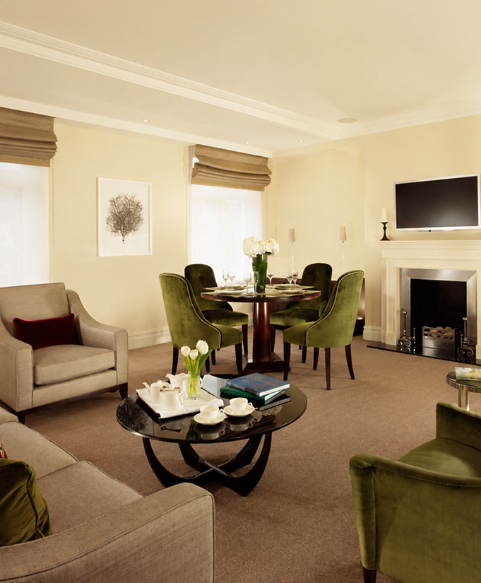 a living room with a fireplace and a table