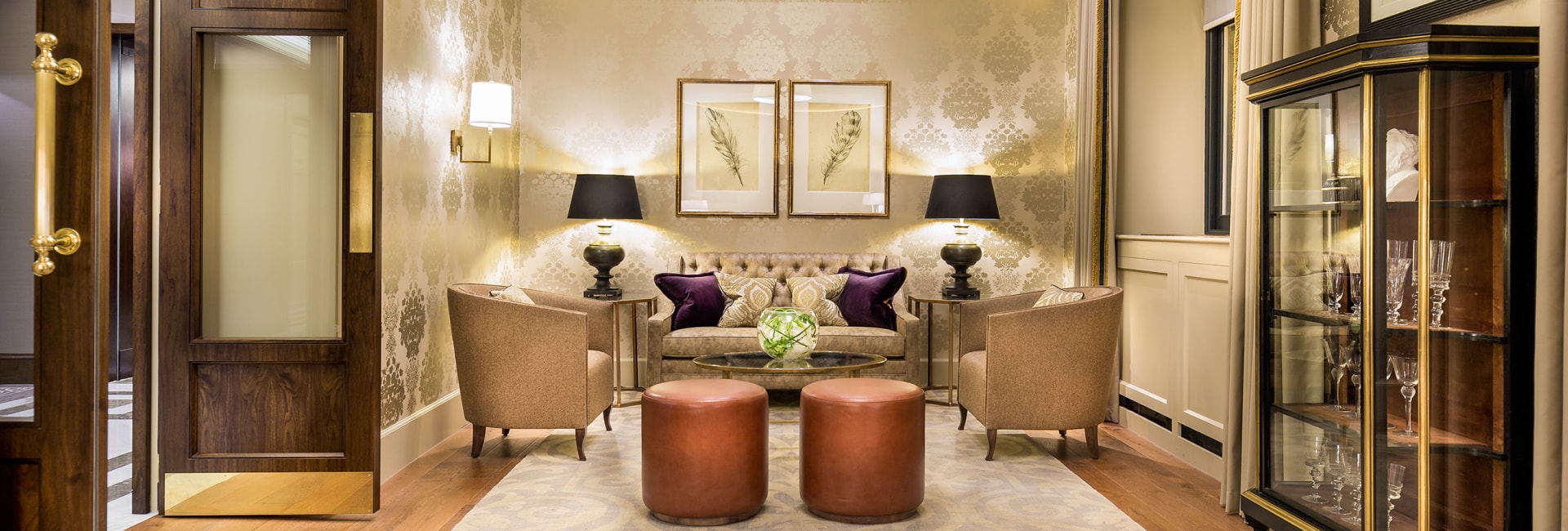 a room with a couch and chairs
