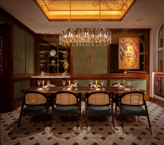 a dining room with a chandelier and chairs