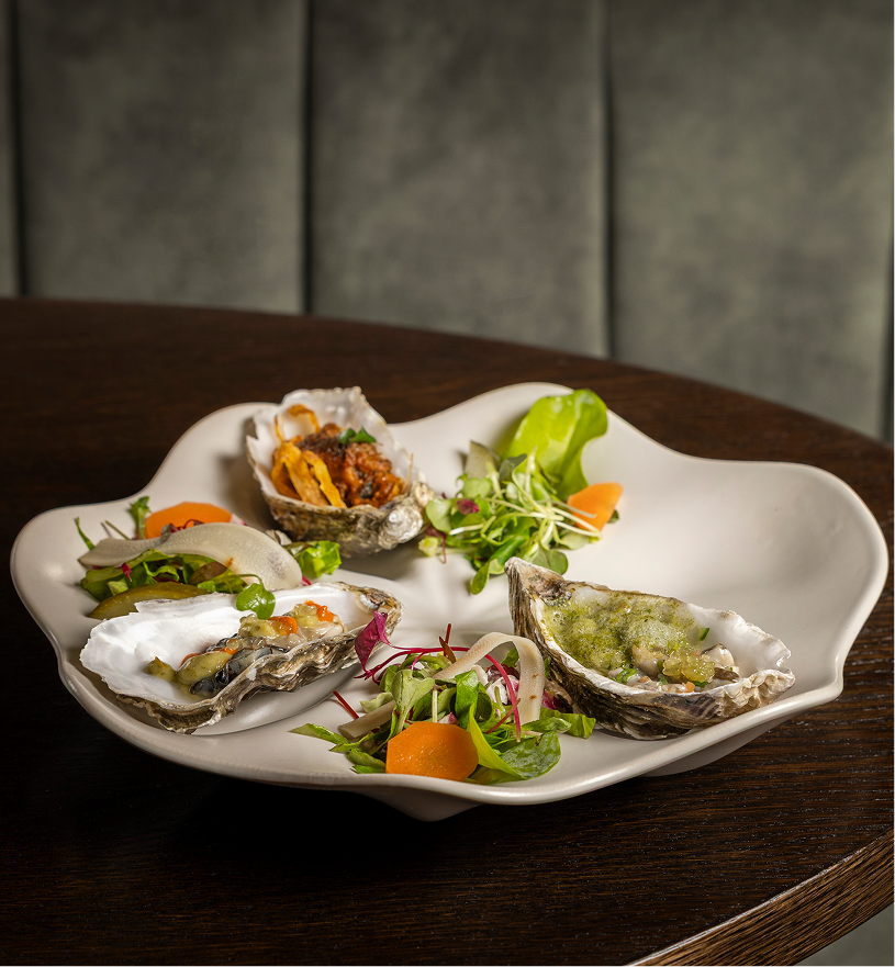 a plate of oysters on a table