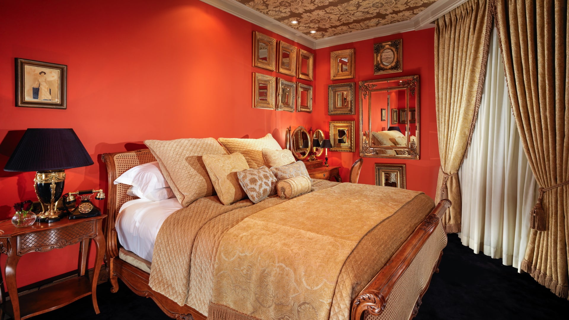a bed with a mirror and a dresser