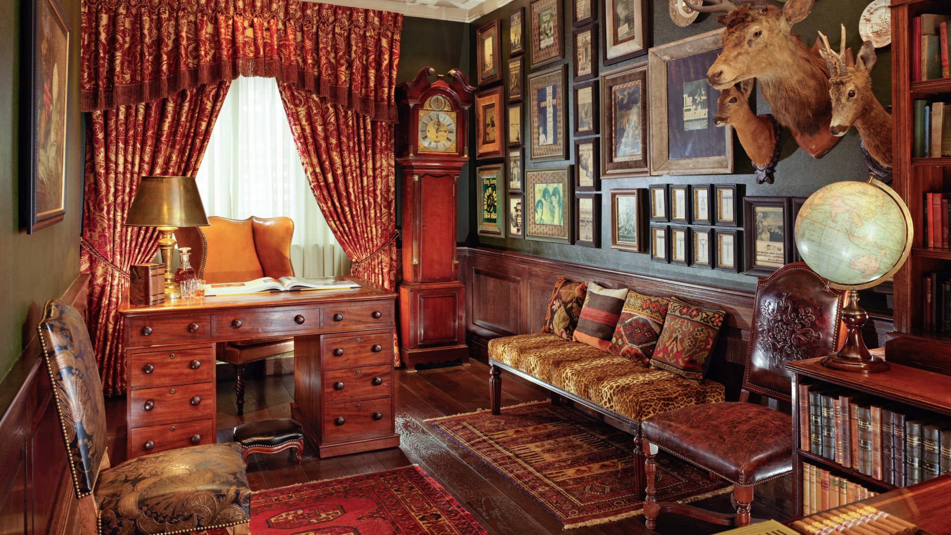 a room with a clock and a desk