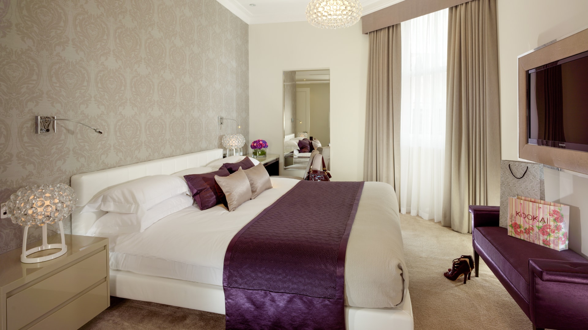 a bedroom with a bed and a mirror