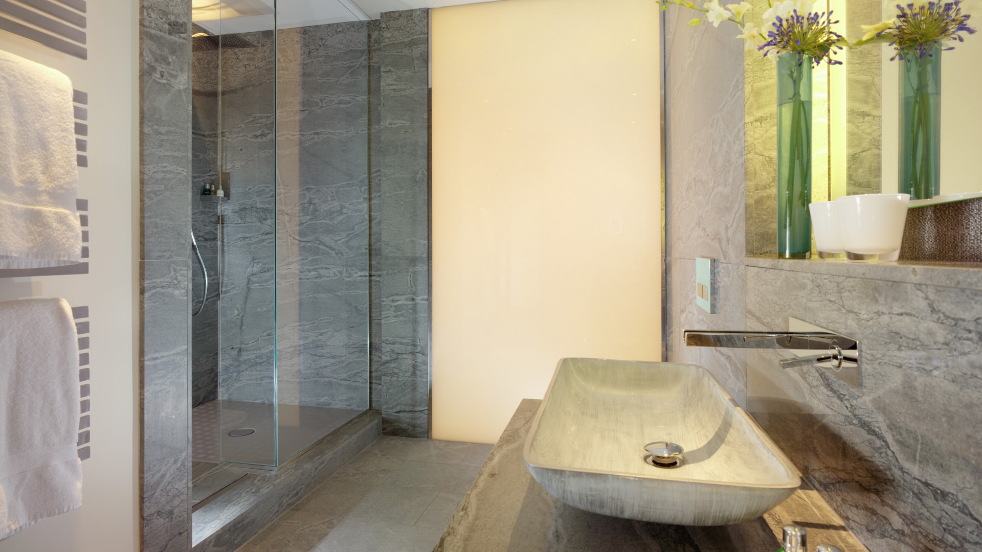 a bathroom with a sink and shower