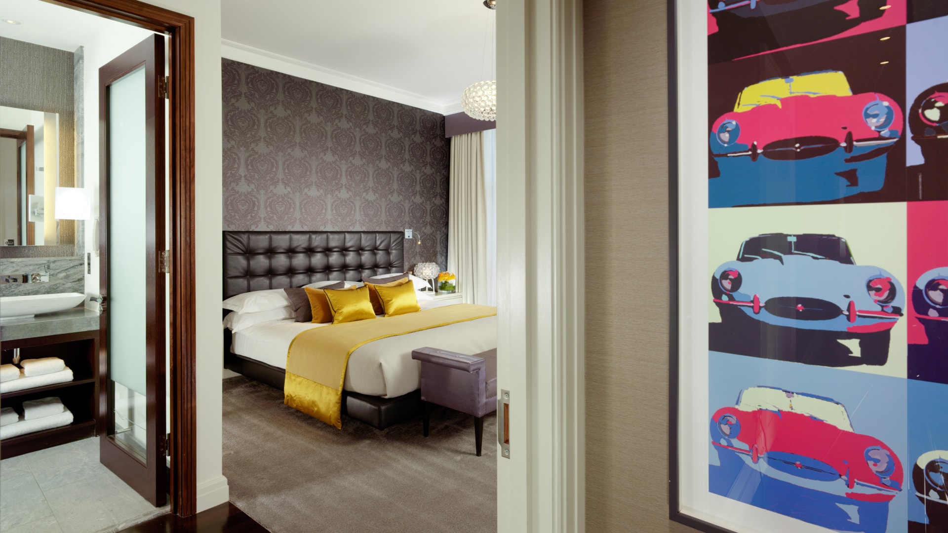 a bedroom with a bed and a chair