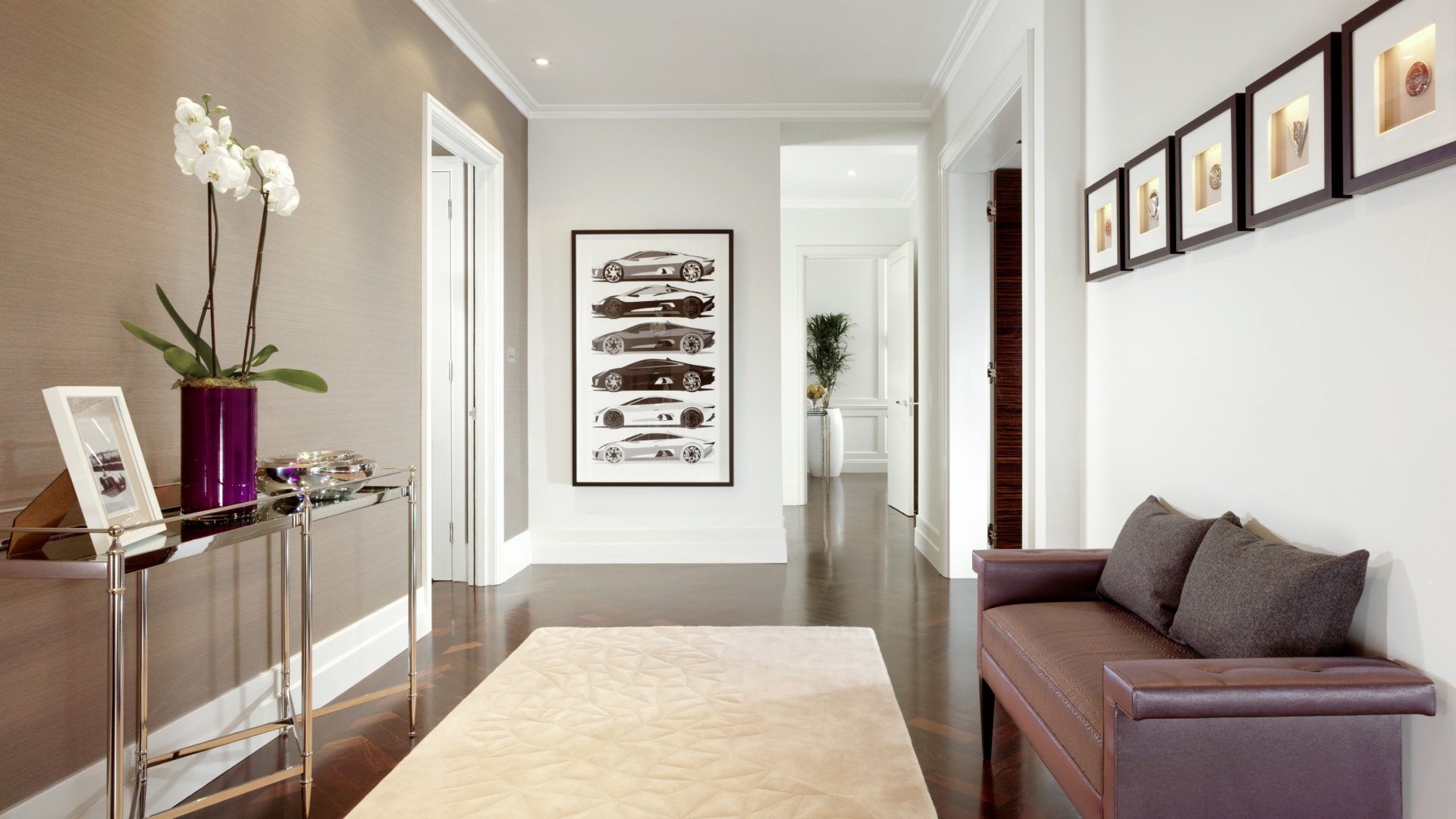 a room with a couch and a painting on the wall