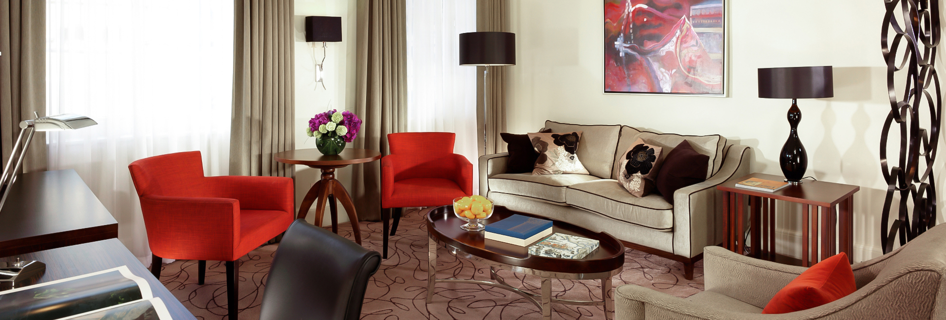 a living room with couches and chairs