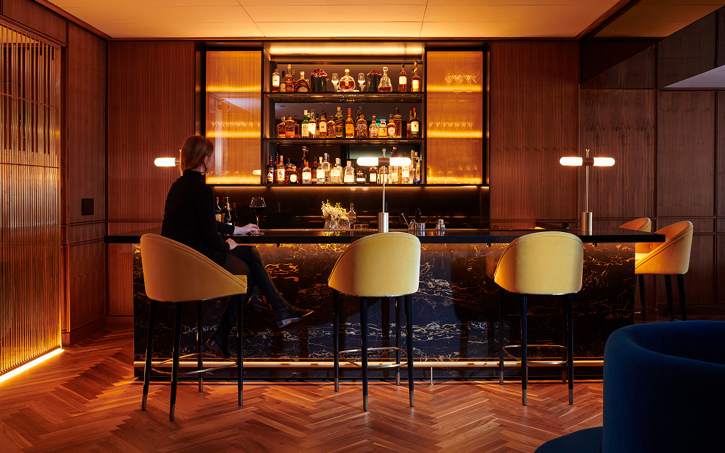 a woman sitting at a bar