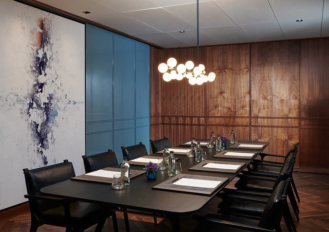 a conference room with a table and chairs