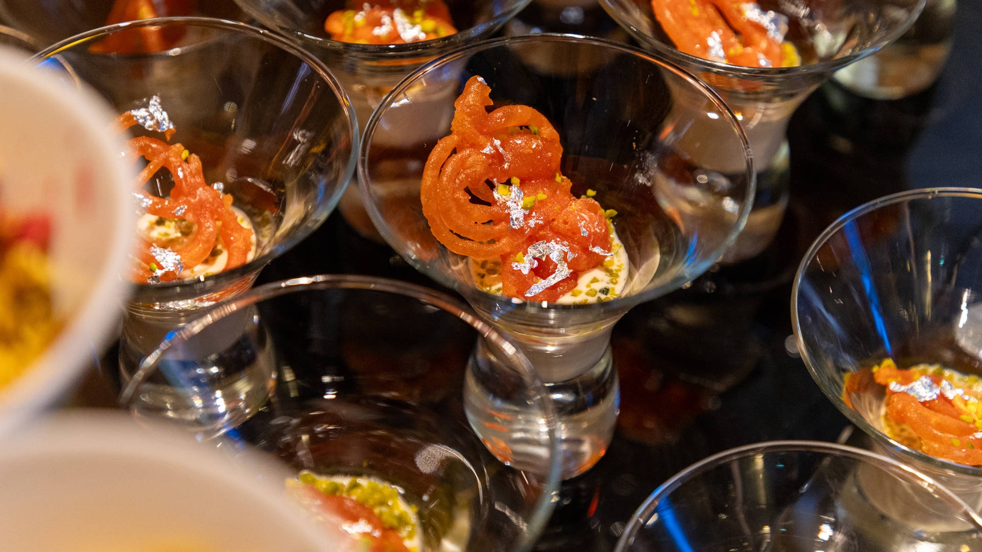 a group of glasses with food in them
