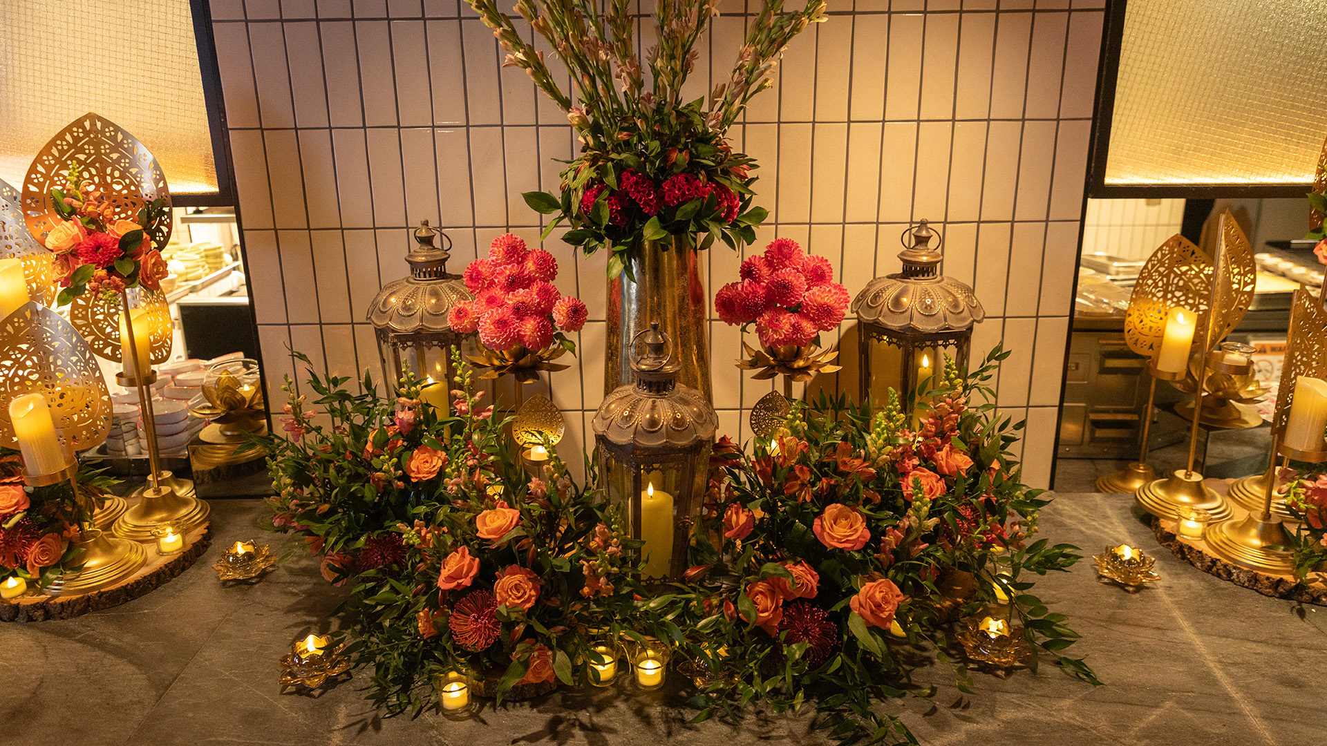 a group of flowers and candles