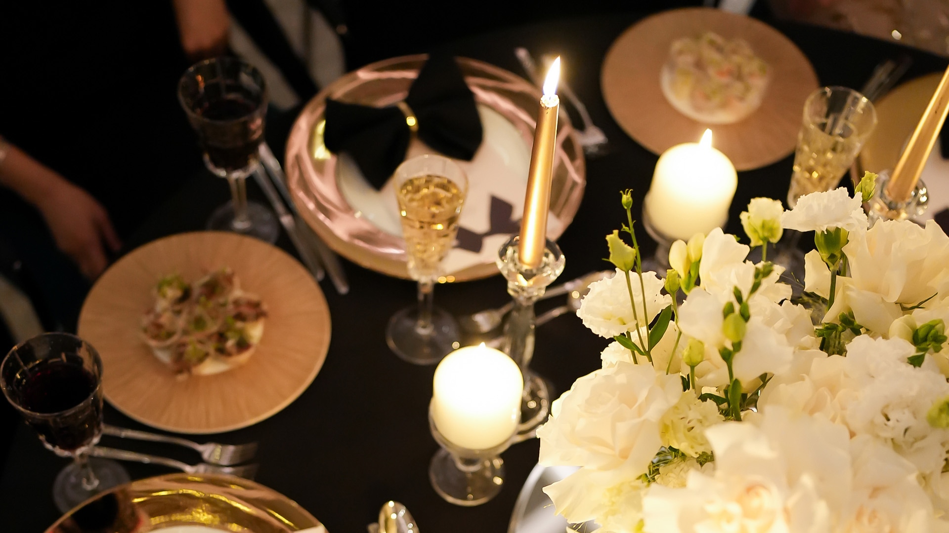 a table with plates and candles