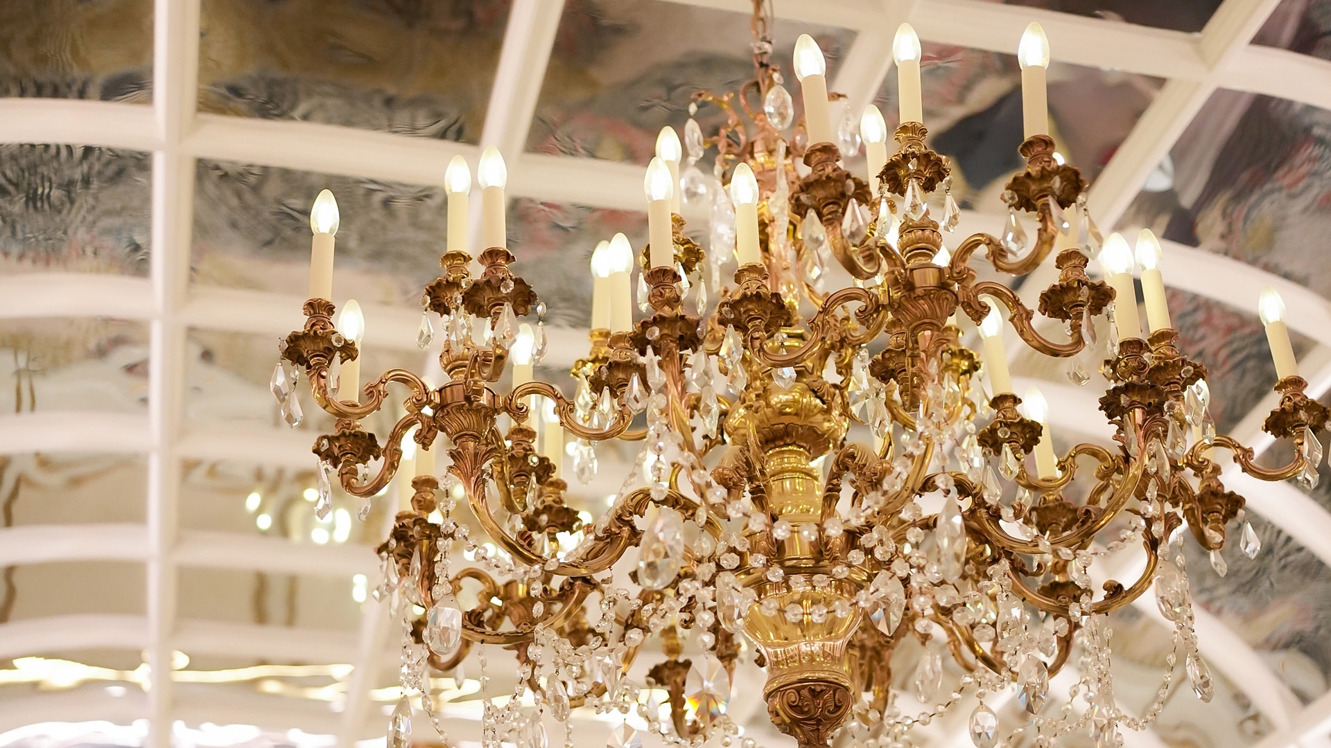 a chandelier with lights from the ceiling