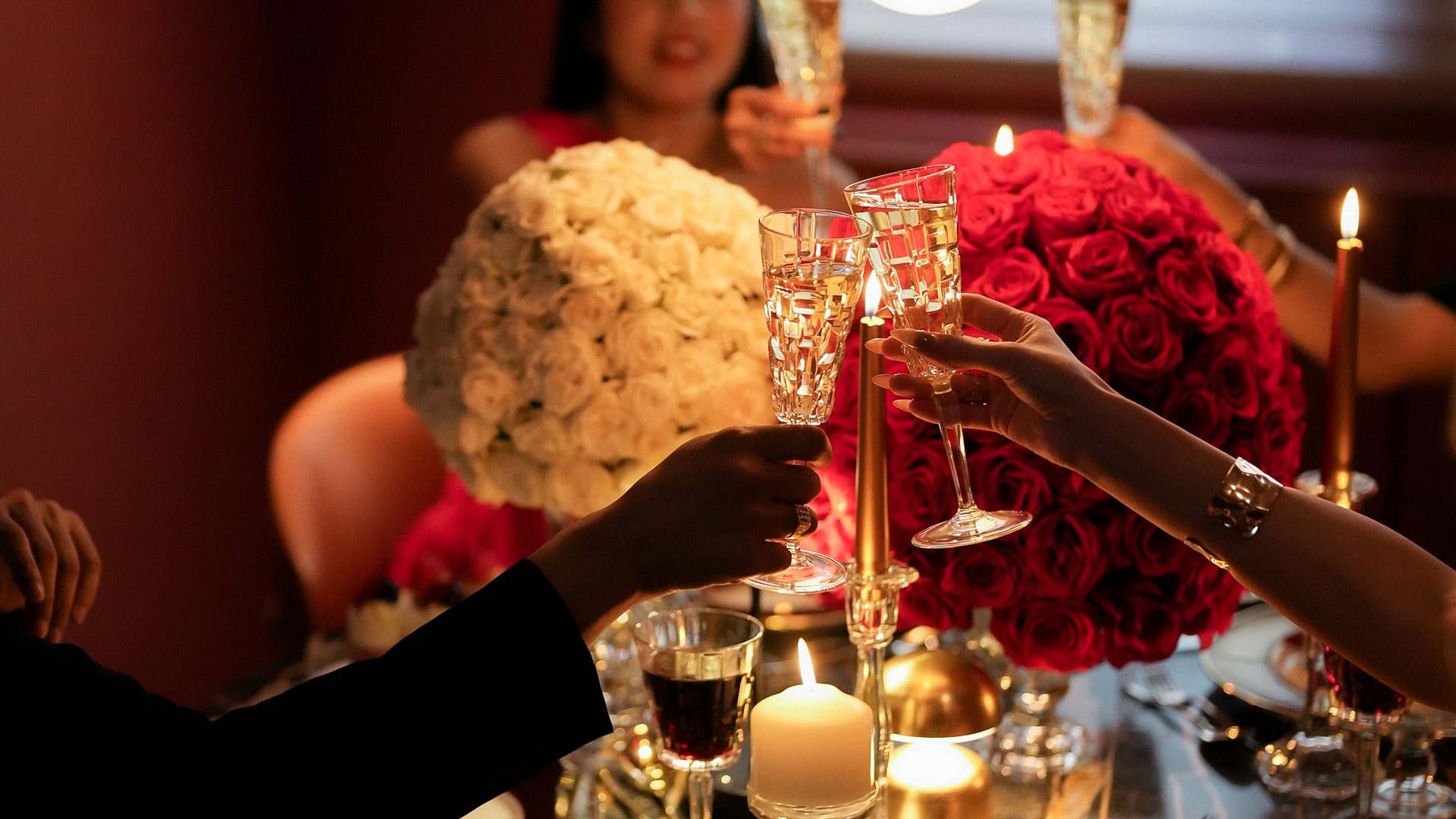 a group of people holding champagne glasses