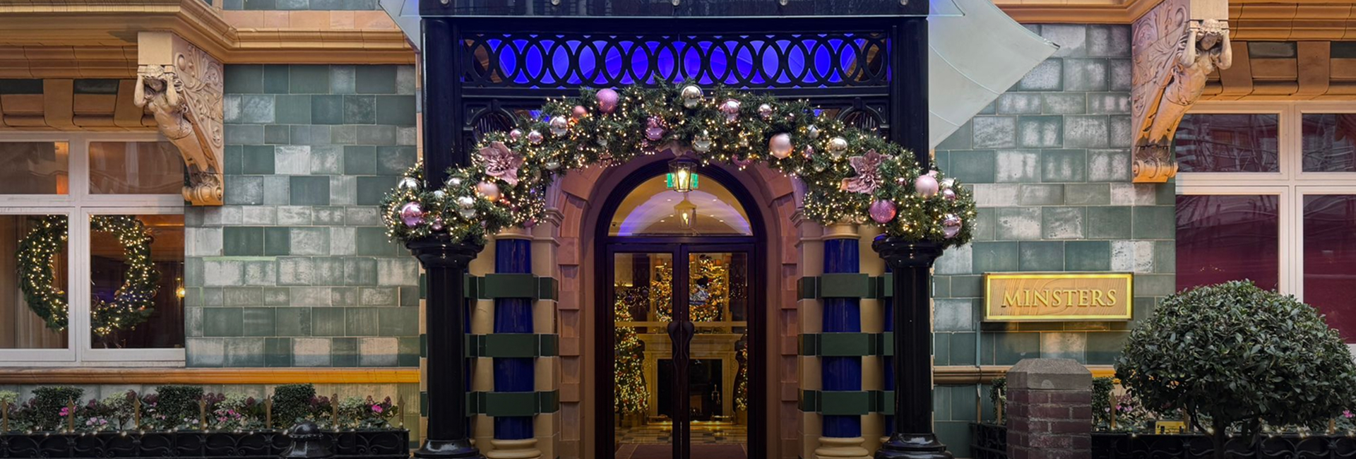a door with a garland of lights and decorations