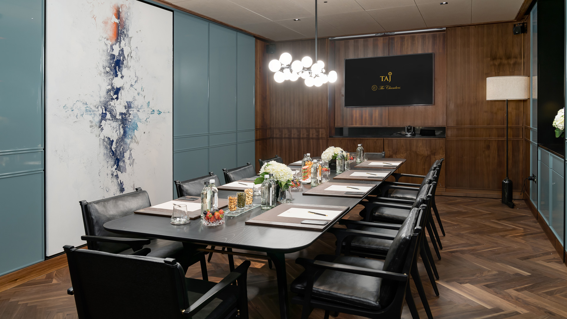 a conference room with a table and chairs