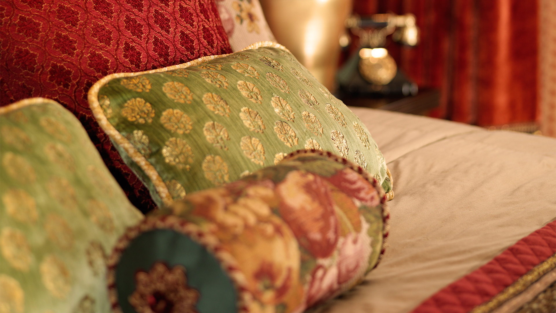 a close up of pillows on a bed