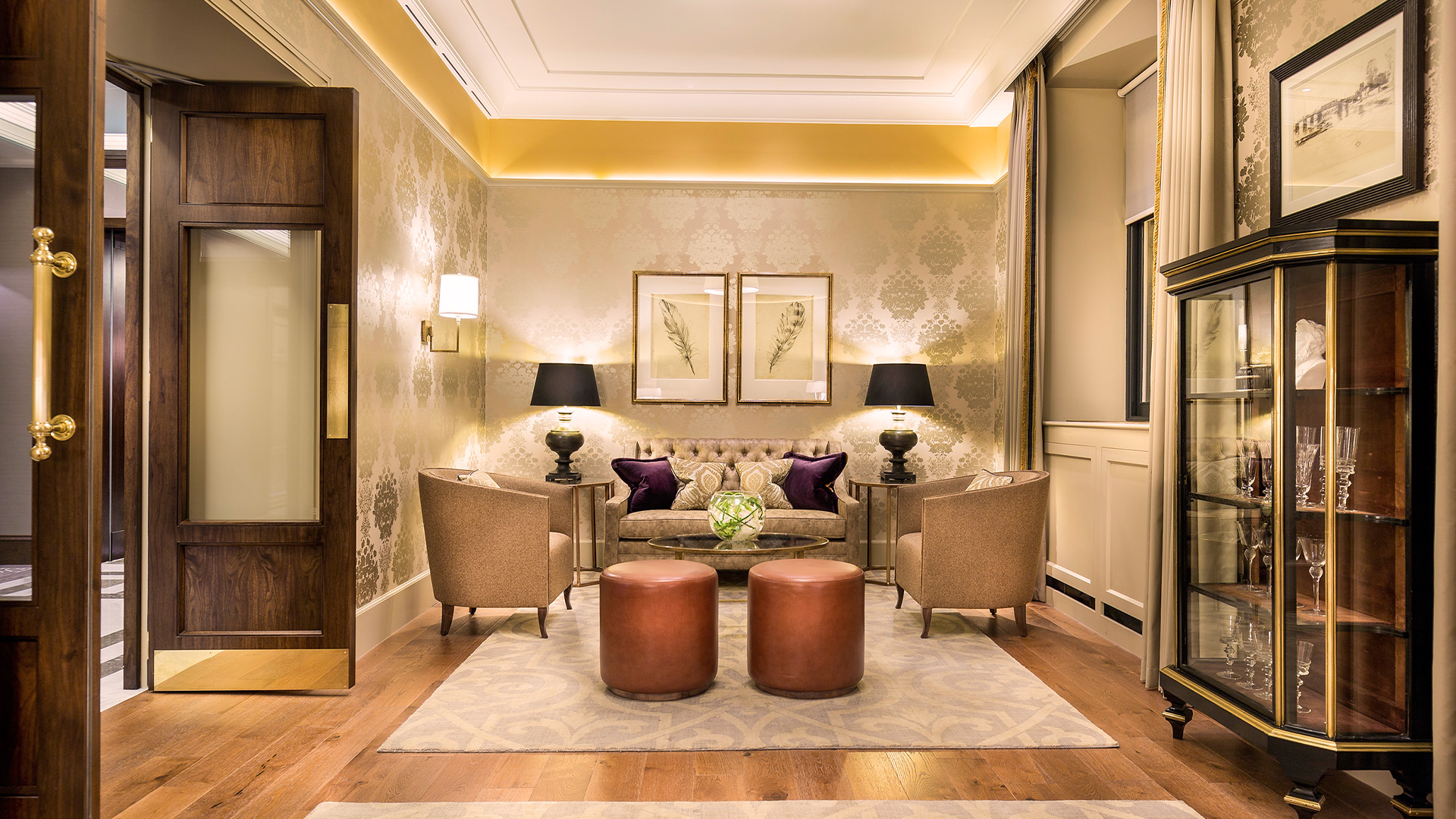 a room with a couch and chairs