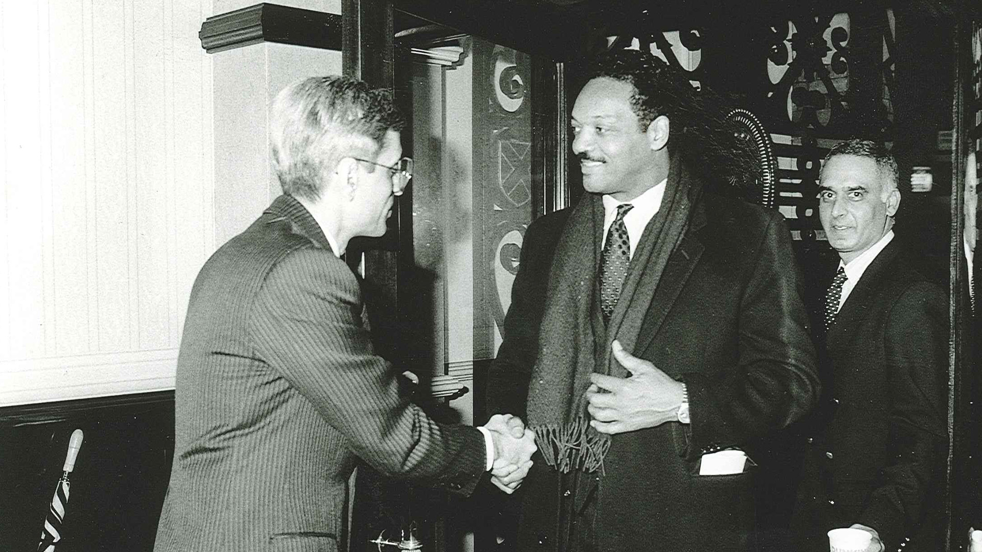 a man shaking hands with another man