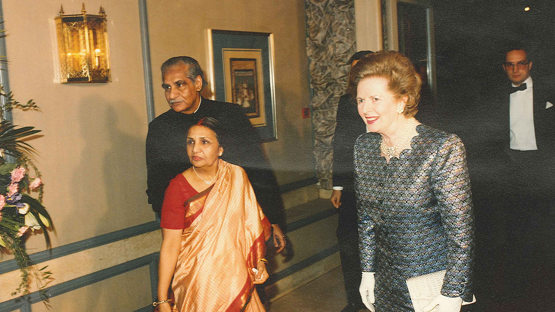 a group of people walking in a room