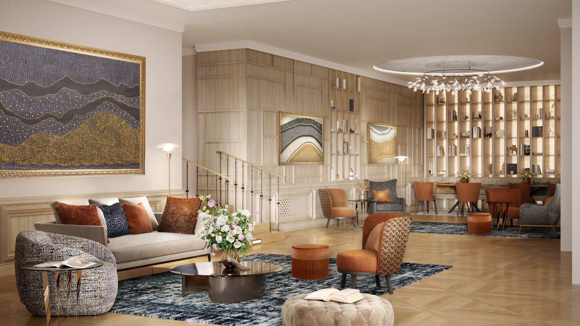 a living room with a staircase and art on the wall