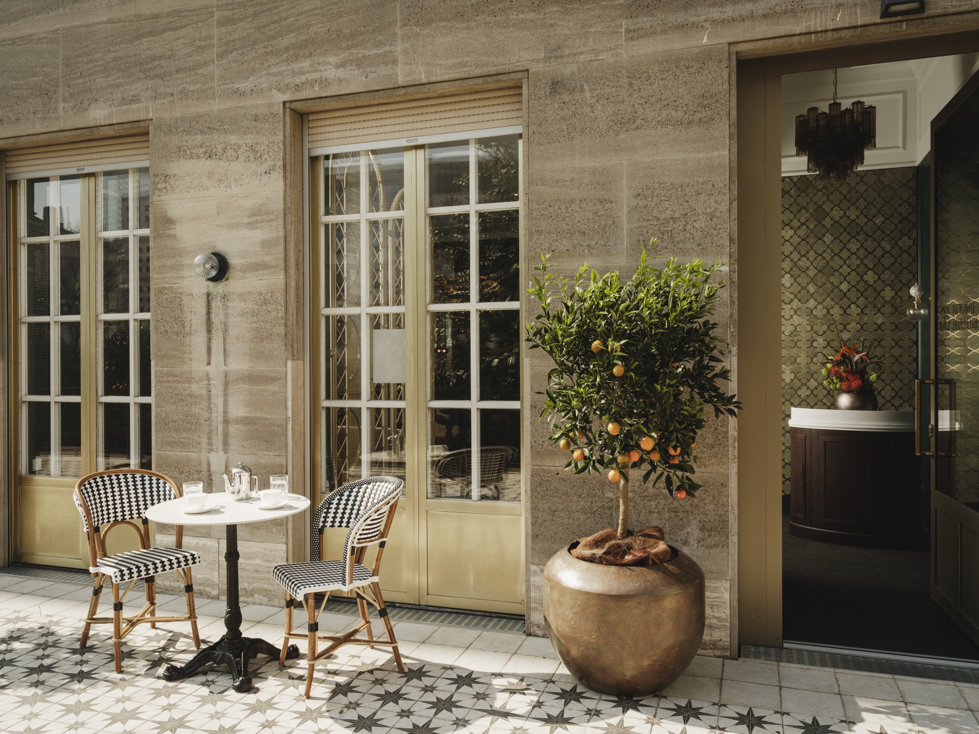 a table and chairs outside of a building