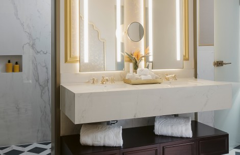 a bathroom sink with towels on top of it
