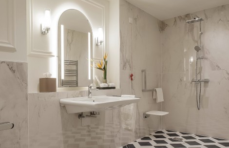 a bathroom with a sink and mirror