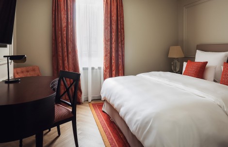 a bed and chair in a room