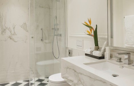 a bathroom with a glass shower and sink