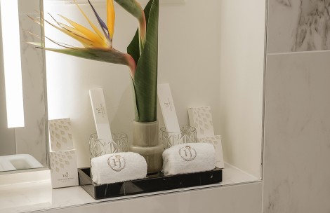 a flower in a vase with towels