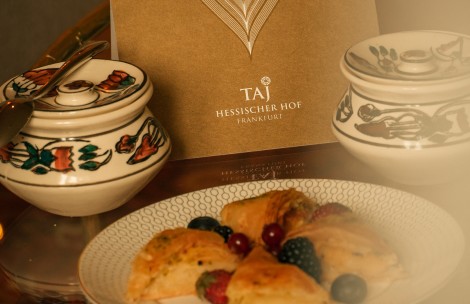 a plate of pastries and a menu