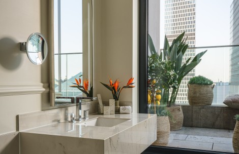 a bathroom with a large window and a sink