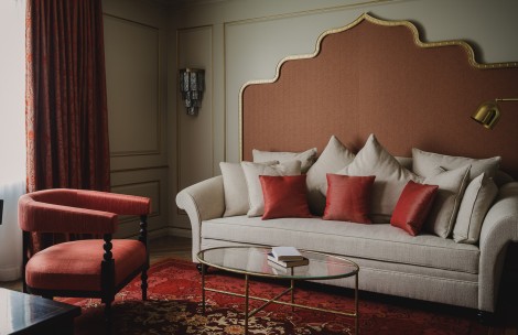 a couch with pillows in a room