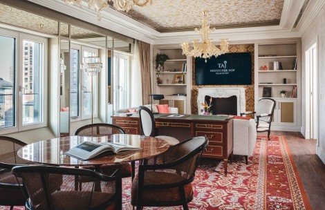 a room with a table and chairs