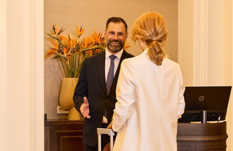 a man and woman in suits and ties
