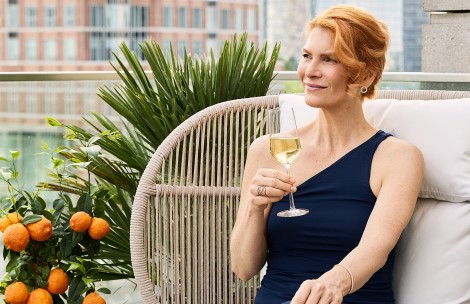 a woman holding a glass of wine