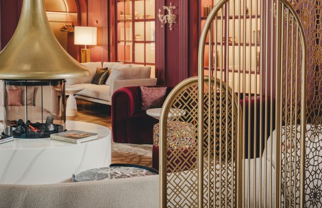 a room with a gold screen and a red wall