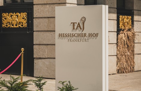 a sign in front of a building