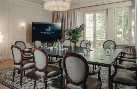 a room with a television and a table