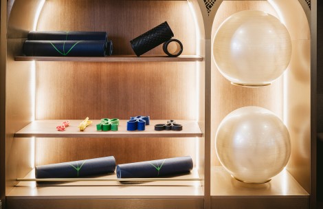 a shelves with yoga mats and balls
