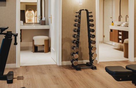 a room with a gym and a mirror