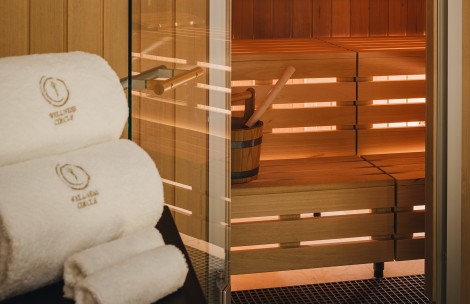a sauna with towels and bucket of shovels