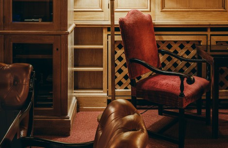 a chair next to a lamp