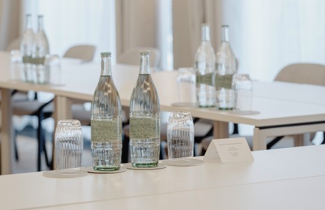 a group of bottles and glasses on a table
